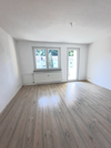 Wohnzimmer mit Balkonzugang