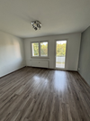 Wohnzimmer mit Balkonzugang