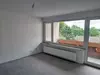 Wohnzimmer mit Balkon