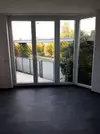 Wohnzimmer mit Balkon