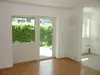 Wohnzimmer mit offener Küche